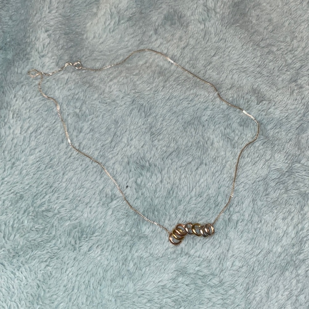 golf and silver ring necklace